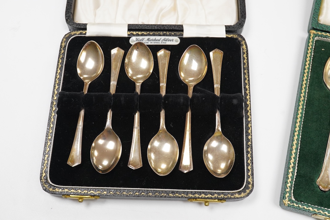 A collection of silver and white metal to include a 19th century Indian dressing table pot and cover chased with flowers, a three piece silver condiment set by Mappin and Webb with associated condiment spoon, three cased
